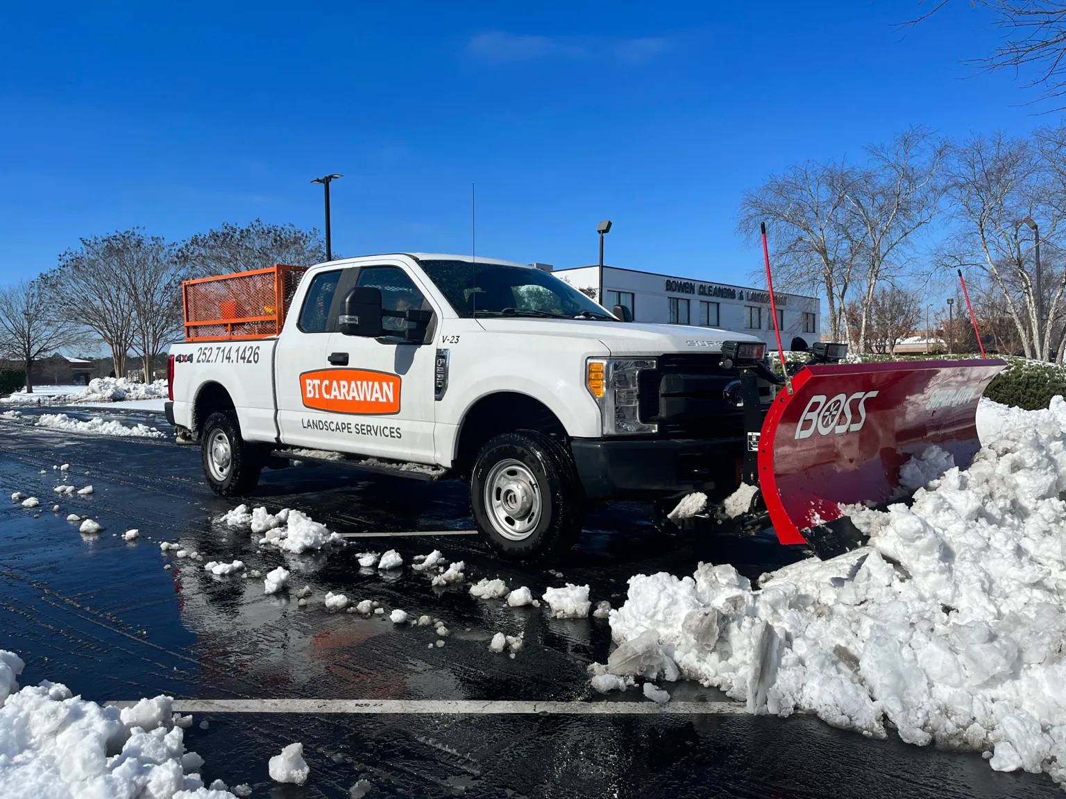 BT Carawan truck door and front plow in snow